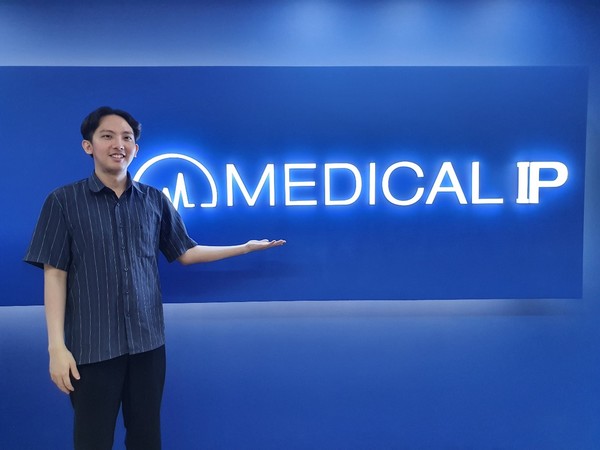 Medical IP’s R&D assistant manager, Joseph Witanto, poses in front of the company logo during a recent interview with Korea Biomedical Review.