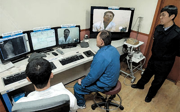 An inmate receives telemedicine service at a correctional facility. (Source: The Korea Doctors’ Weekly database)