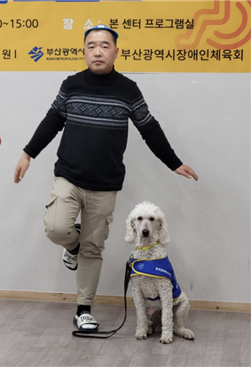 Kim Jeong-cheol, a 47 years old male living in Busan with epilepsy, receiving training with his epilepsy helper dog Lily.