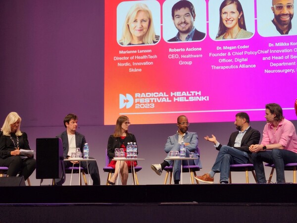 Panelists on stage discuss the regulatory environment for innovative solutions at Radical Health Festival Helsinki 2023 on Tuesday evening.