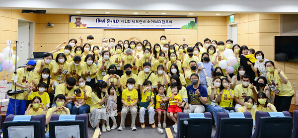 Children, caregivers, and doctors pose for a photo to commemorate the first opening of the Iron Child event at Severance Hospital in Seodaemun-gu, Seoul, on May 19.