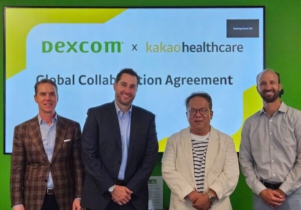 Officials from Kakao Healthcare and Dexcom pose for a photo after signing a global collaboration agreement to provide CGM (continuous glucose monitoring) based blood glucose management services at Dexcom headquarters in San Diego. They are from left, Dexcom Executive Vice President Global Revenue Paul Flynn, Dexcom Chief Financial Officer Jereme Sylvain, Kakao Healthcare CEO Hwang Hee, and Dexcom Executive Vice President of Strategy, Corporate Development & Dexcom Labs Matt Dolan.