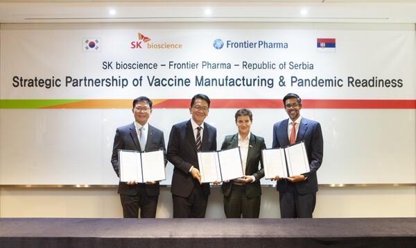 From left, SK bioscience  CEO Ahn Jae-yong, SK discovery Vice Chairman Chey Chang-won, Serbian Prime Minister Ana Brnabić, and Frontier Biopharma CEO Kiren Naidu show the signed MOU between the organizations. (Credit: SK bioscience) 