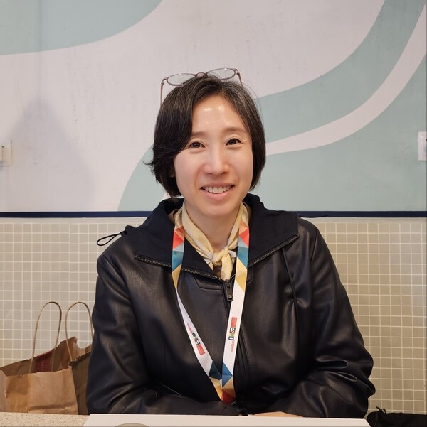 Curocell Vice President Kim Jong-ran talks about Anbal-cel’s potential on the sidelines of ESMO 2023 in Madrid, Spain. (KBR photo)