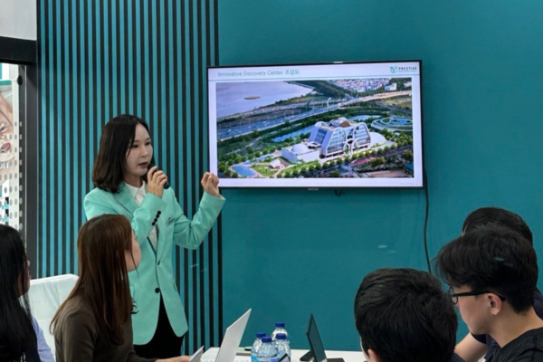 Prestige Biopharma Group Chairwoman Park So-yeon explains the group’s Busan Innovative New Drug Research Center to reporters at the company's booth at CPHI Worldwide 2023 in Barcelona, Spain, on Tuesday, local time.