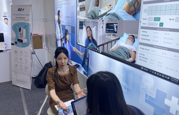 Nateesha Tai, country manager of Korea at AVer Information, discusses the company's efforts to alleviate the strain on Korea's healthcare system through certified medical-grade PTZ cameras and telemedicine solutions during an interview with Korea Biomedical Review at the K-Hospital Fair, held at COEX, Seoul, on Oct. 4. (Credit: AVer Information)